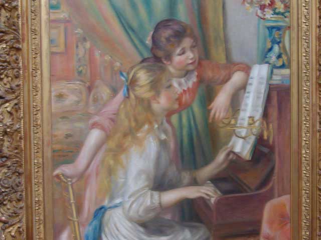 Muchachas tocando el piano de Renoir